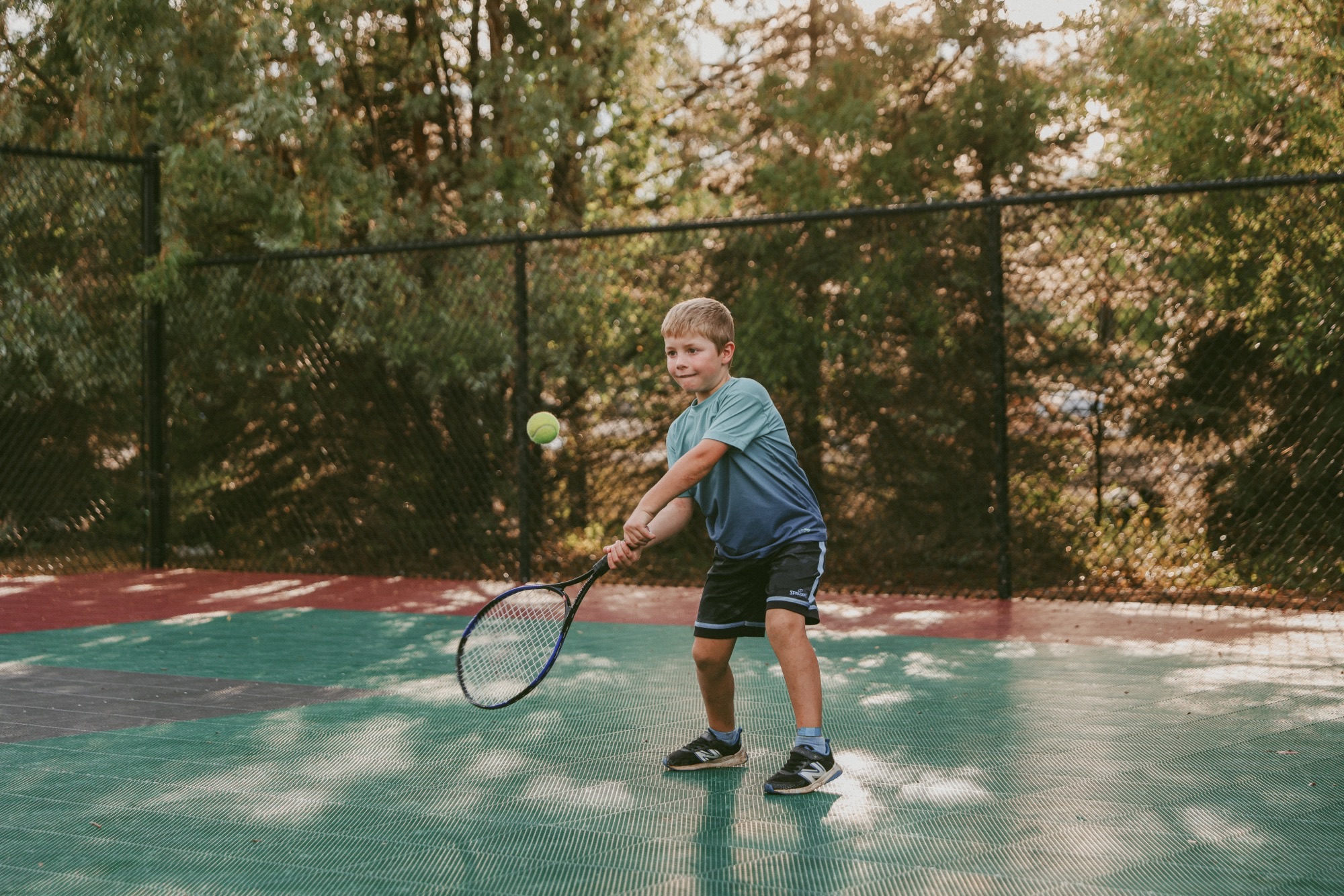 Kid playing on the court in Hilliard's Bay Estates